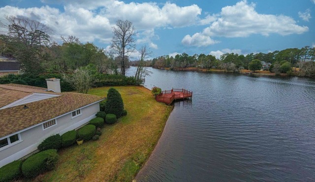 Waterfront Paradise with Golf Course Views